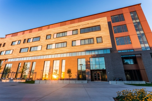 The west entrance of the Carolyn and Kem Gardner Commons at sunset. 